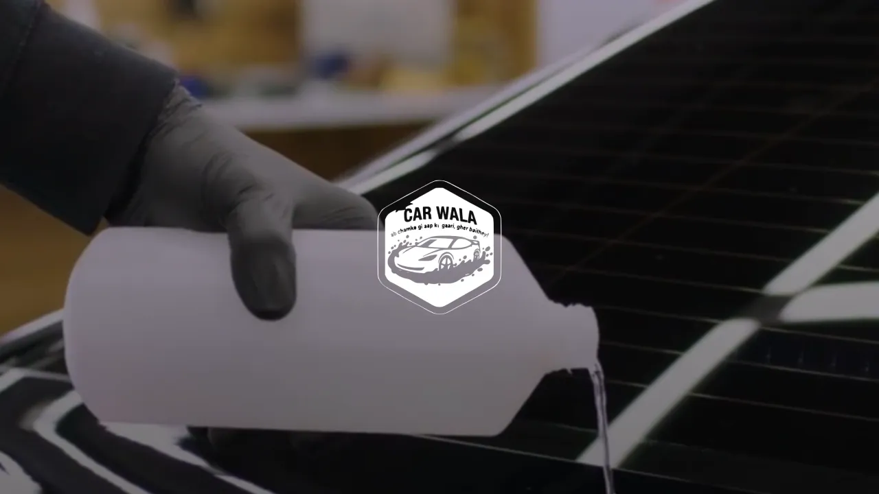 Car Wala, the badge over a detailer pouring foam on a black bonnet
