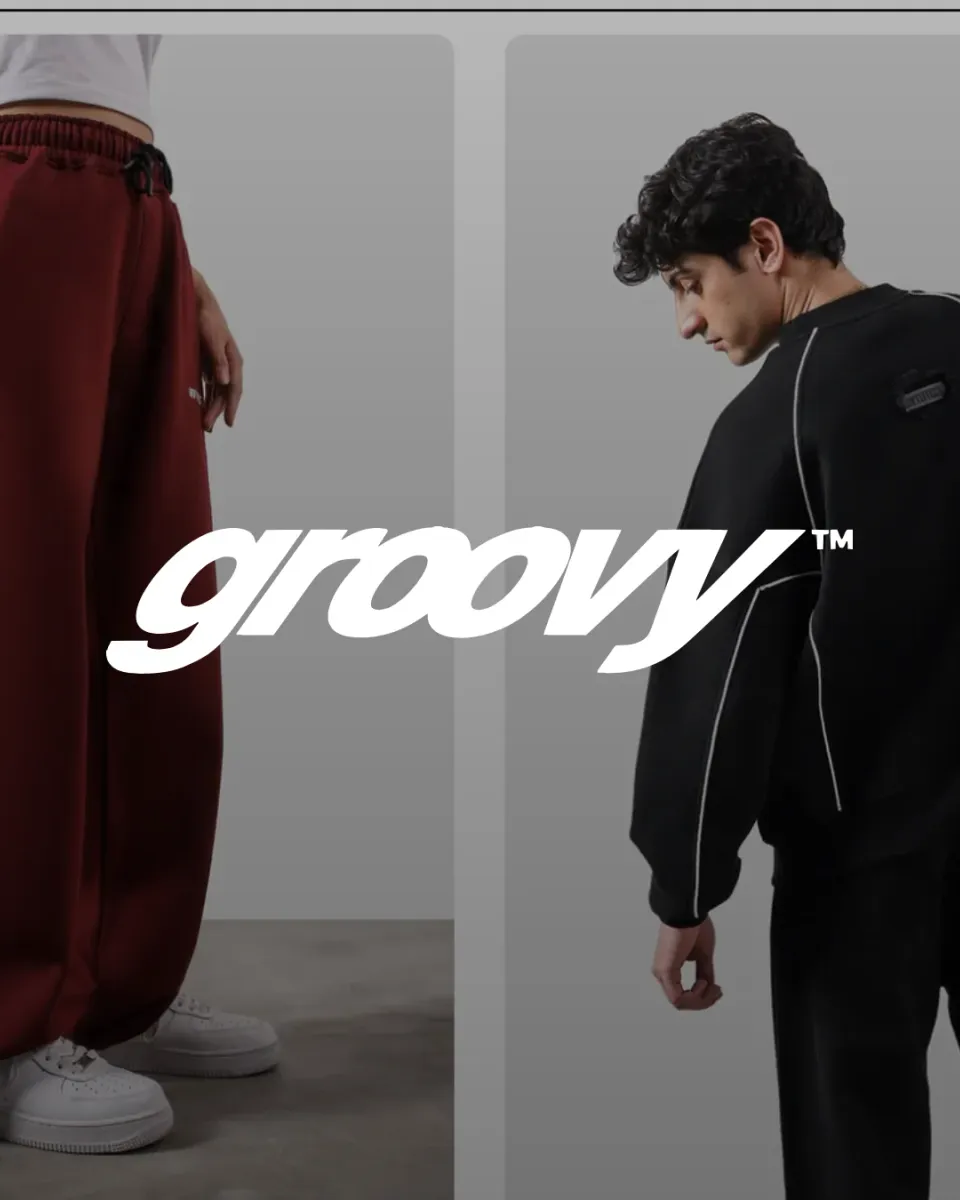 Groovy, the wordmark over models in streetwear